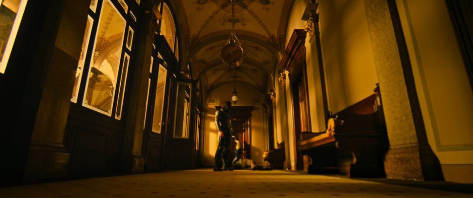 Bucky stands in the hallway over his target.