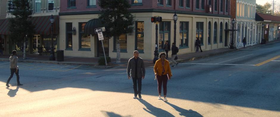 Sam and Sarah walk away from the bank after being denied their loan.