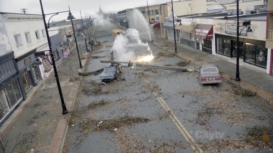 The survivors come upon a downed power pole in the middle of the street.