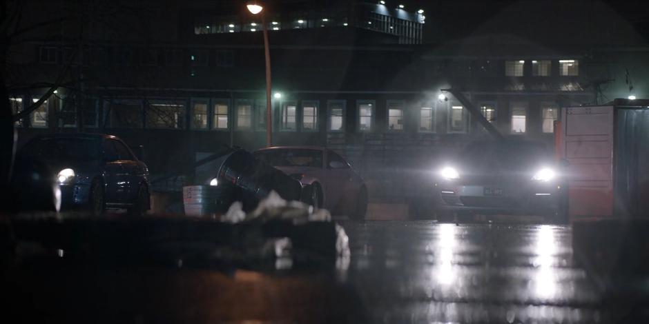 The three cars wait for the stolen Fear Toxin to be loaded into their trunks.