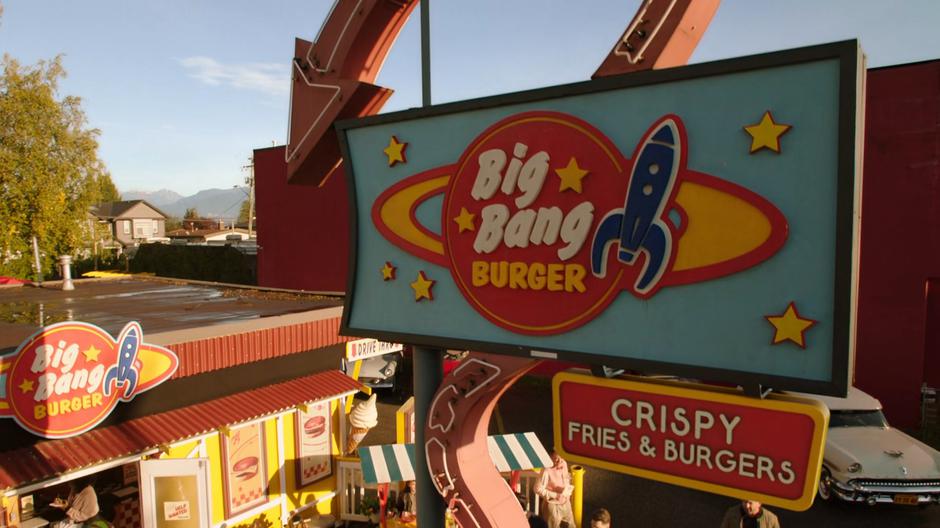 View of the Big Bang Burger sign over the busy restaurant.