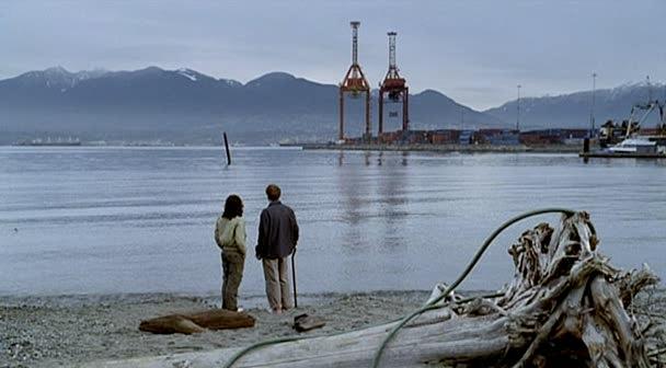 Max and Logan look across the water towards the port.