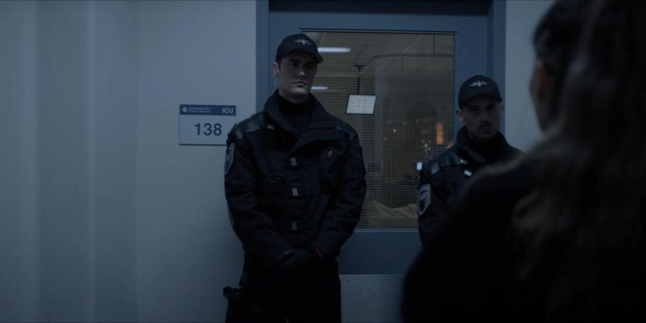 Two guards stand at the door to Luke’s room blocking Mary’s approach.