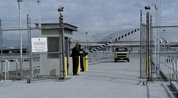 The truck with Max hiding on top leaves the facility.