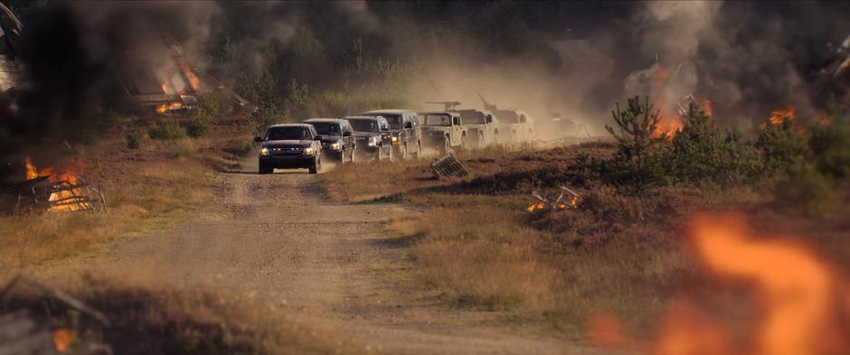 Lights flash on the government vehicles as they approach the crash site.