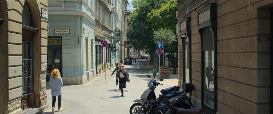 Natasha runs behind Yelena and asks which bike is hers.