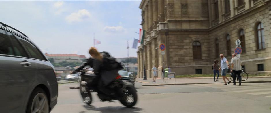 Natasha swerves to the side to avoid an oncoming car.