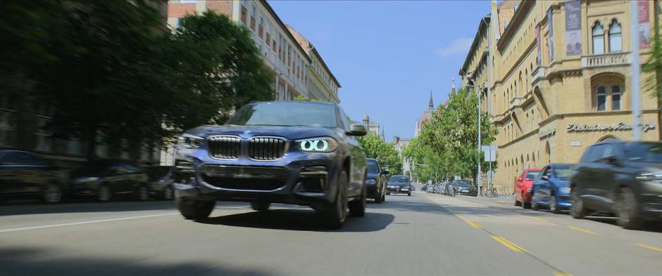 Natasha and Yelena drive down a busy street in their stolen car.