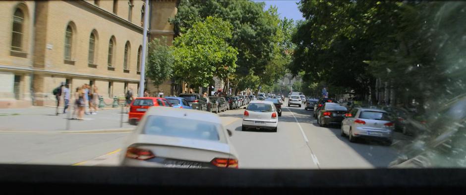 The armored truck pushes its way through other cars.