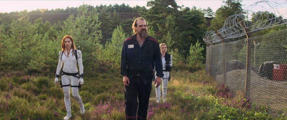 Natasha, Alexei, and Yelena approach the fence surrounding the farm.