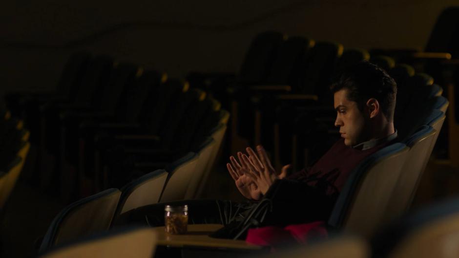 Antonio stares at his hands as he comes down off the truth potion.