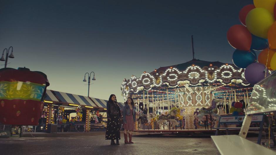 Mel and Maggie look around the carnival.