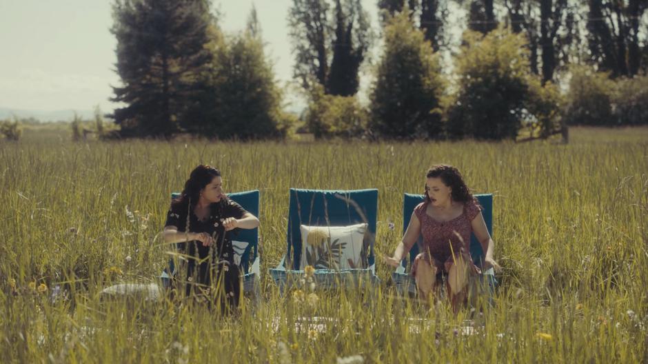 Mel and Maggie look around after being transported from the carnival.