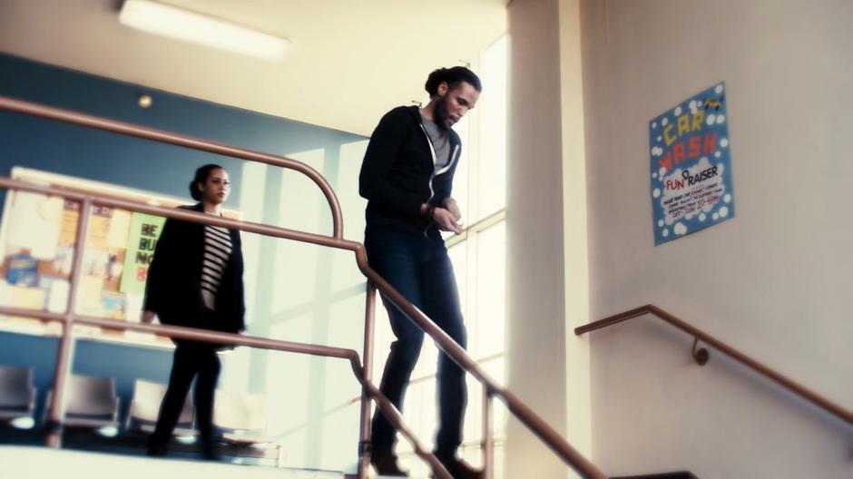 Macy follows Jordan as he rushes down the stairs.