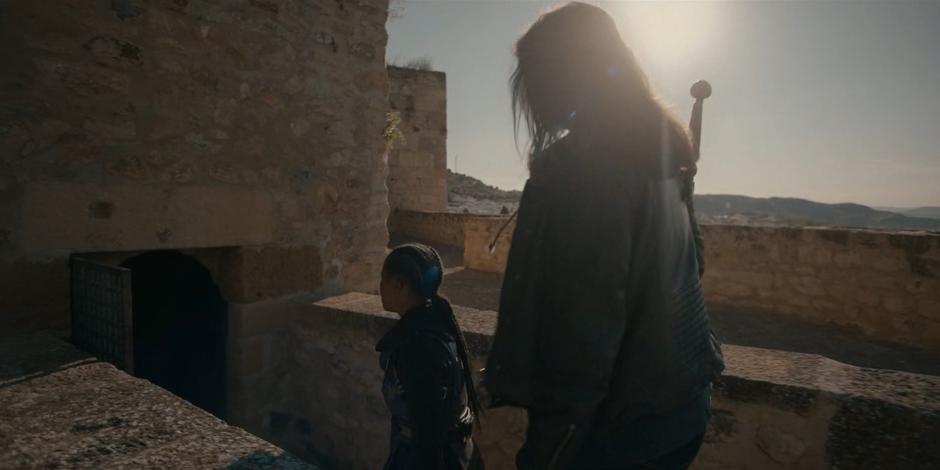 Mary leads Ava into the building through a back entrance.