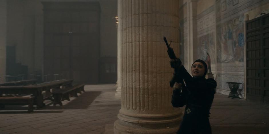 Camila fires a gun at the ceiling to distract the new nuns and give her friends a chance to escape.