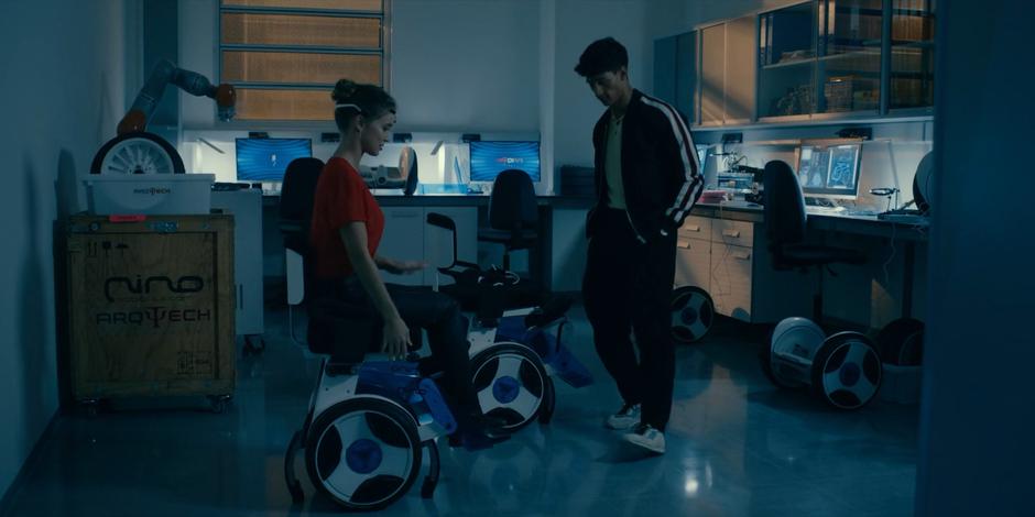 JC watches as Ava plays with one of the fancy mind-controlled wheelchairs.