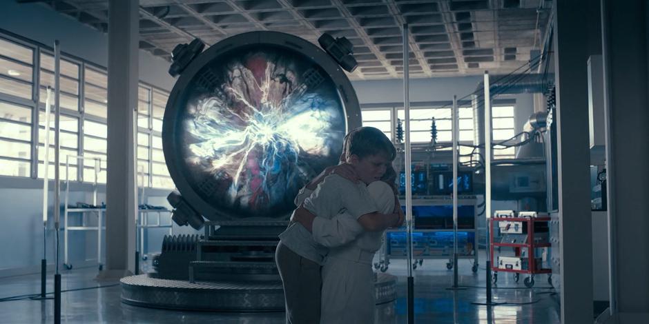 Jillian hugs Michael tightly as the portal opens behind them.