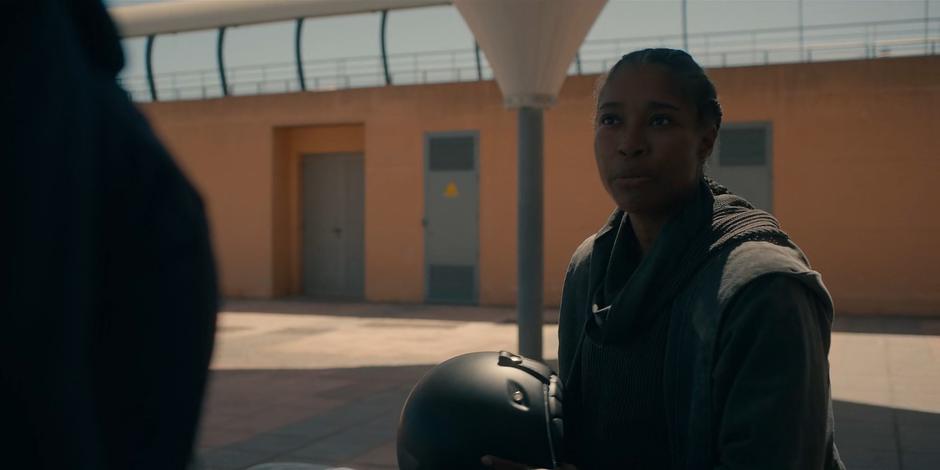 Mary sits on her motorcycle and prepares to head off without Lilith.