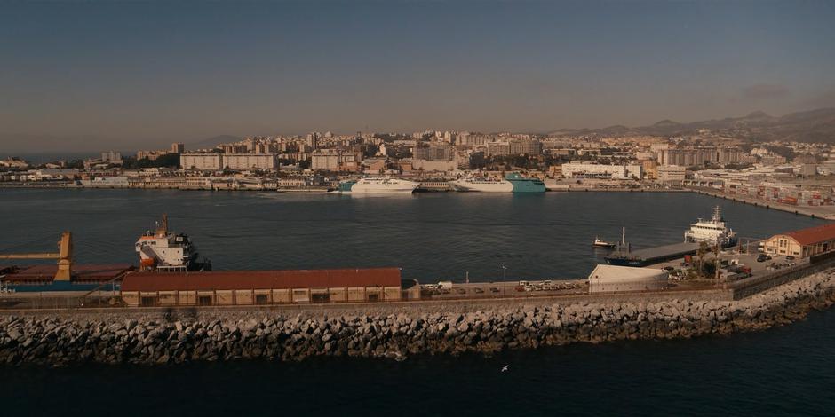 The ferry is visible in the distance docked at the terminal.