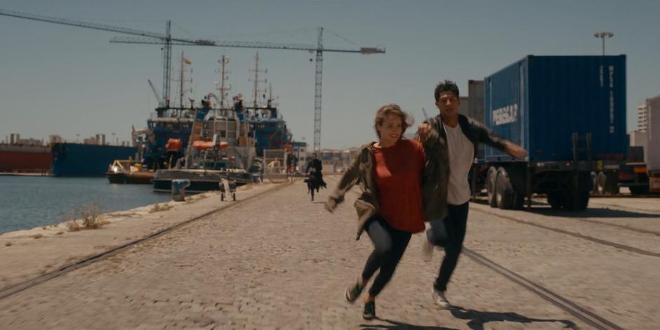 Ava and JC race down the waterfront with Lilith following.