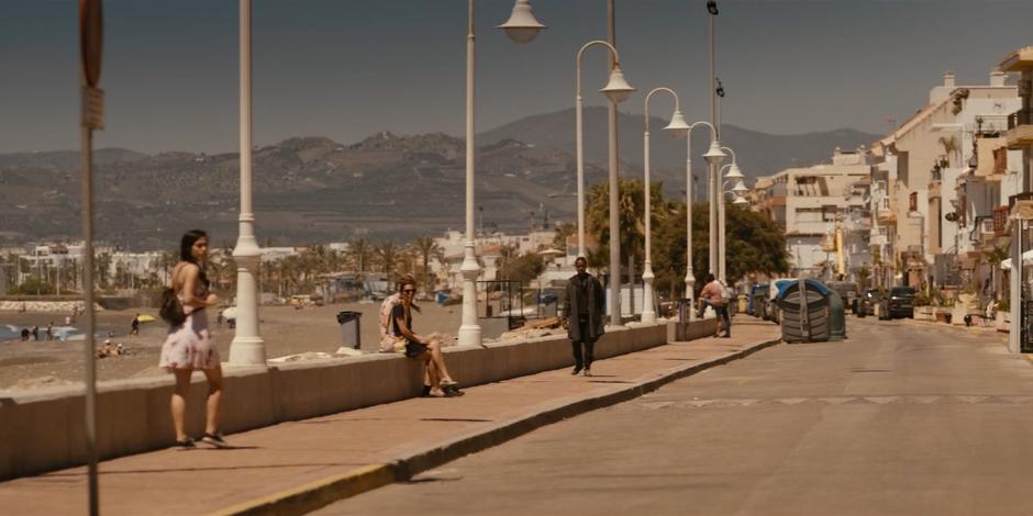 Mary walks down the road by the beach searching for signs of Ava.