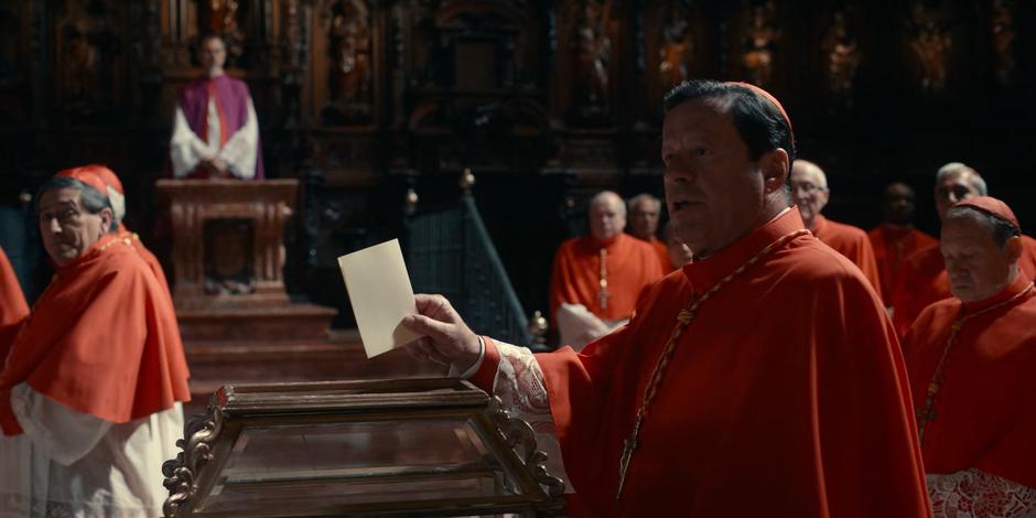 Cardinal Duretti makes a big show as he casts his vote.