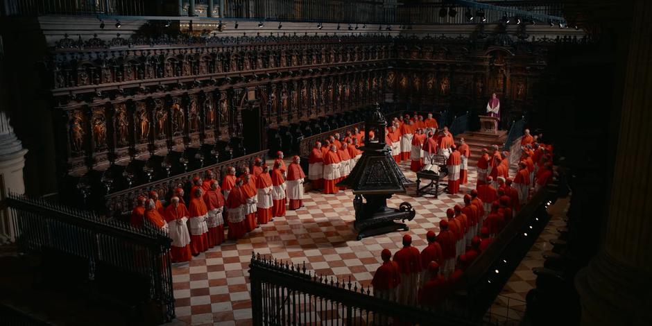 Cardinals stand around as they finish casting their votes.