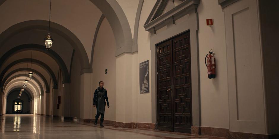 Mary walks down the hallway after splitting off from the group.