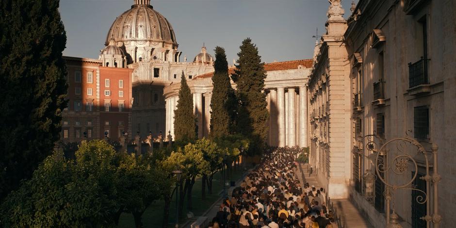 A crowd of people wait outside as they wait for word on the election of the new pope.