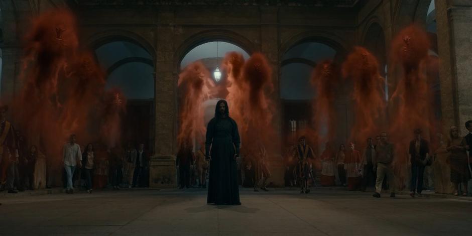 Adriel stands in the middle of the courtyard as wraith demons take control of bystanders.