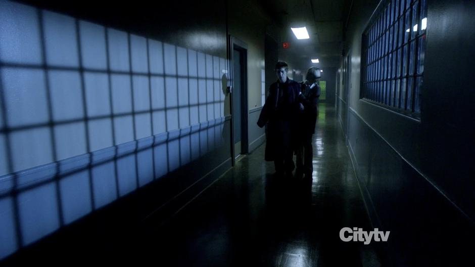 Bernadette walks Sean Keenan down the halls of the hospital.