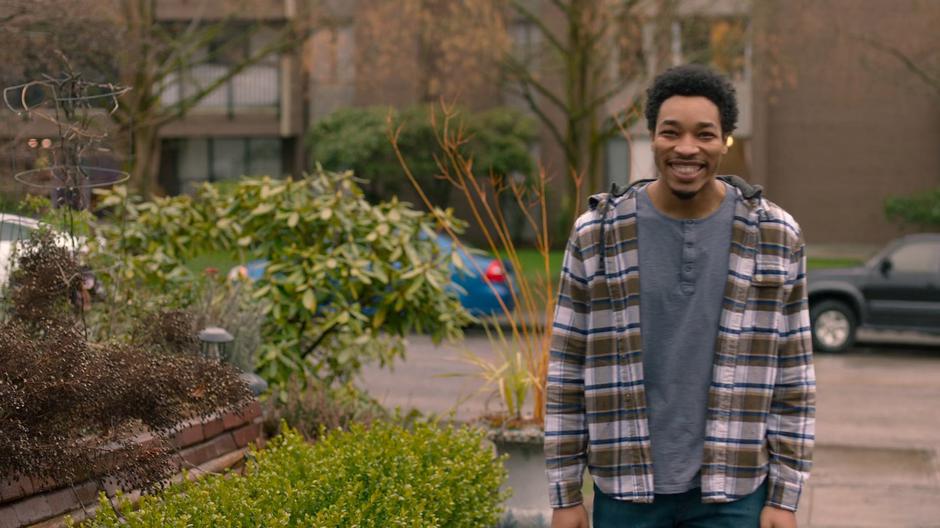 Orlando smiles up at Joey as he walks up to the house.