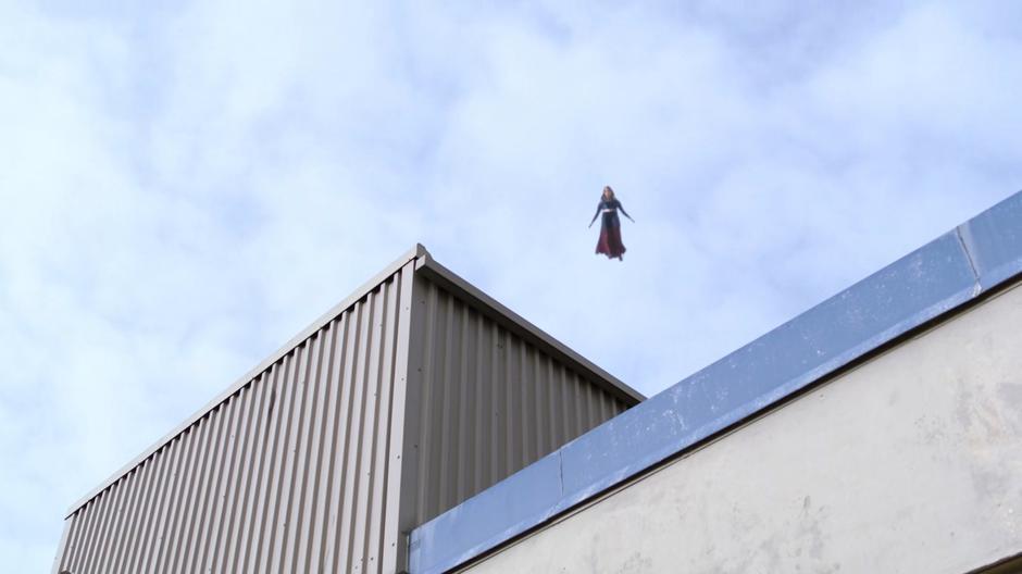 Kara watches from high above as the prisoners are unloaded from the bus.