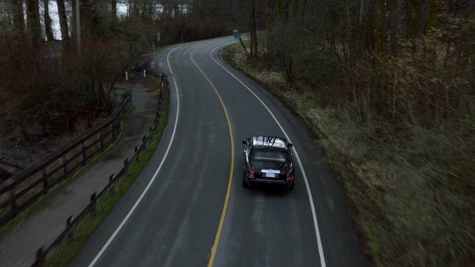 Lena's car heads around the curves while heading through the town where her mother lived.