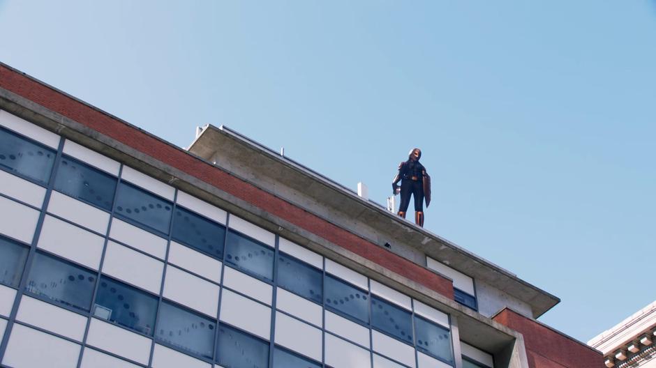 Kelly stands on the rooftop ready to redirect the energy back to the people.