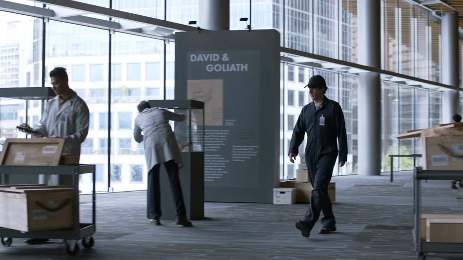 Mitch strolls through the exhibit as it is being set up in disguise.