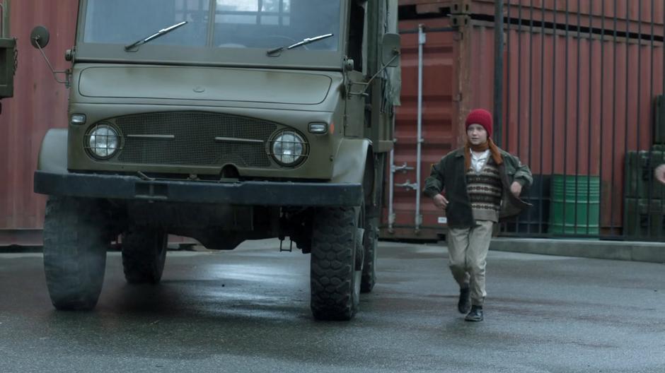 A young girl runs during the panic.