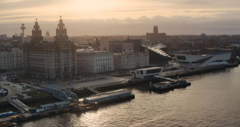 Establishing aerial shot of the Museum of Liverpool on the waterfront.