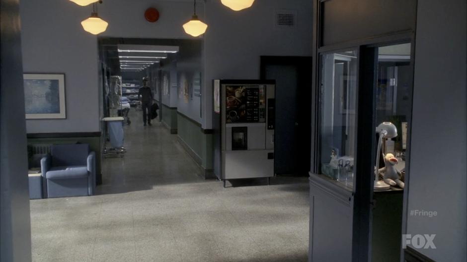 Peter walks down the hall of the hospital after recovering.