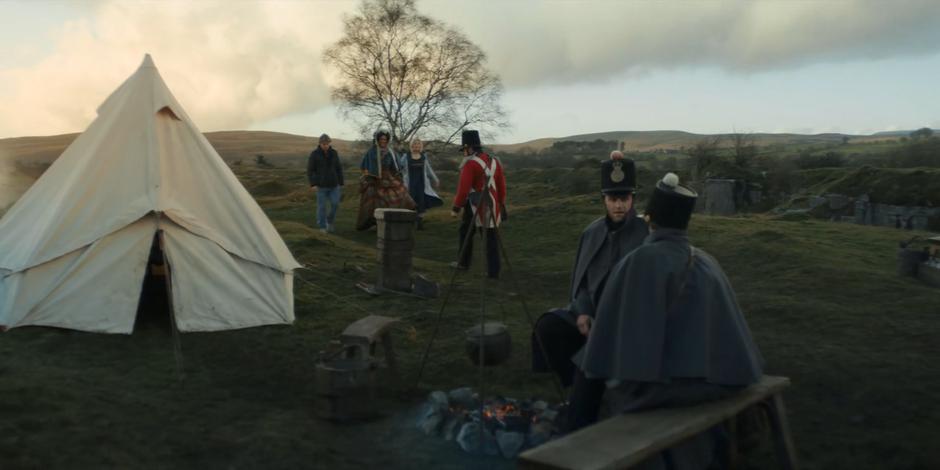 Mary Seacole leads Dan, Yaz, and the Doctor through the Briitsh camp towards her hotel.