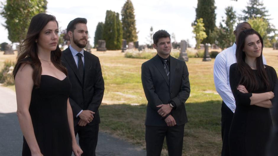 Andrea, Mon-El, Winn, James, and Lena listen to Kara's speech.