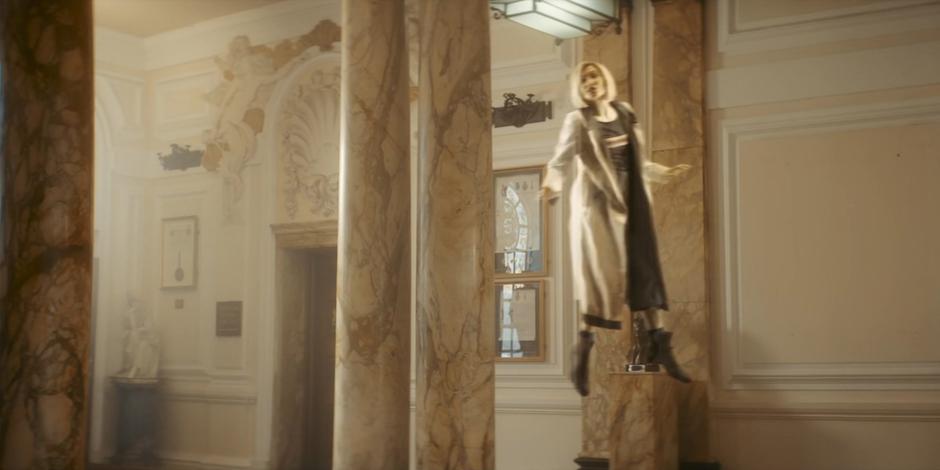 A ghostly, floating image of the Doctor appears in the corner of the room.