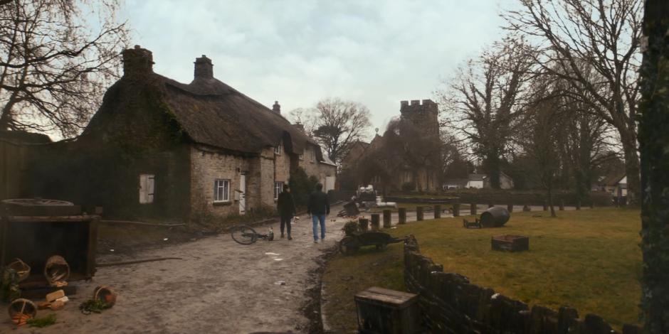 Yaz and Dan walk through the deserted town.