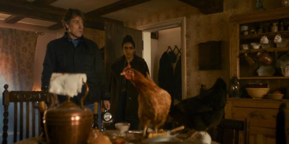 Dan and Yaz enter the house to find chickens on the table.