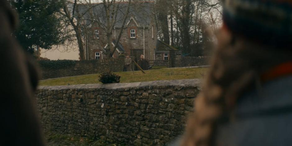 Gerald and Jean approach from the distance while Yaz, Dan, and Peggy try to warn them to stop.