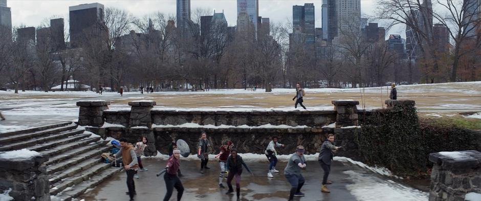 The LARPers practice together on a landing in Central Park.