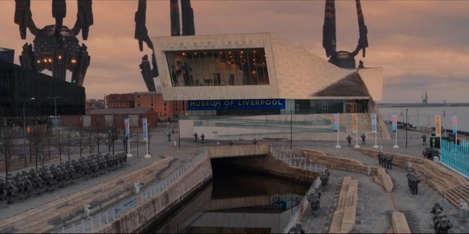 Sontaran soldiers patrol the plaza while their ships sit behind the museum.