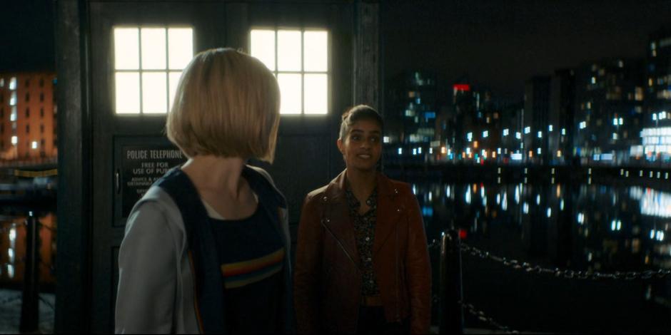 The Doctor looks back over her shoulder at Yaz as she invites Dan to join them again.