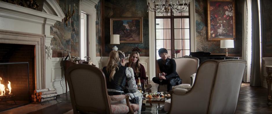 Yelena, Ana, and Sonya sit in the living room discussing what Ana has been doing to earn money.